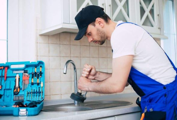 Professional plumbing services in Parma Heights draining a kitchen sink