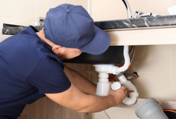 Professional plumbing services in Parma Heights installing a new pipe