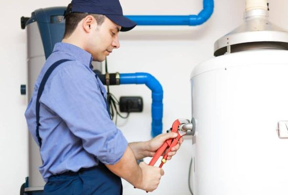 Professional plumbing services in Parma Heights installing a water heater