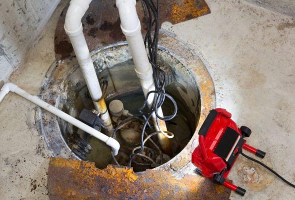 Professional plumbing services in Parma Heights repairing a sump pump