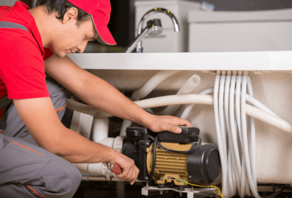 Professional plumbing services in Strongville Oh fixing the bathroom's sink.