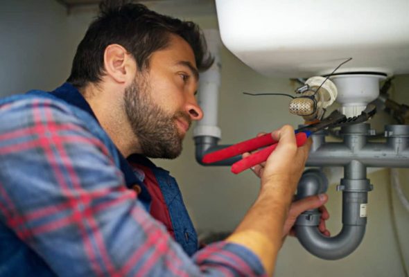 Professional plumbing services in Strongville ohio fixing a bathroom sink